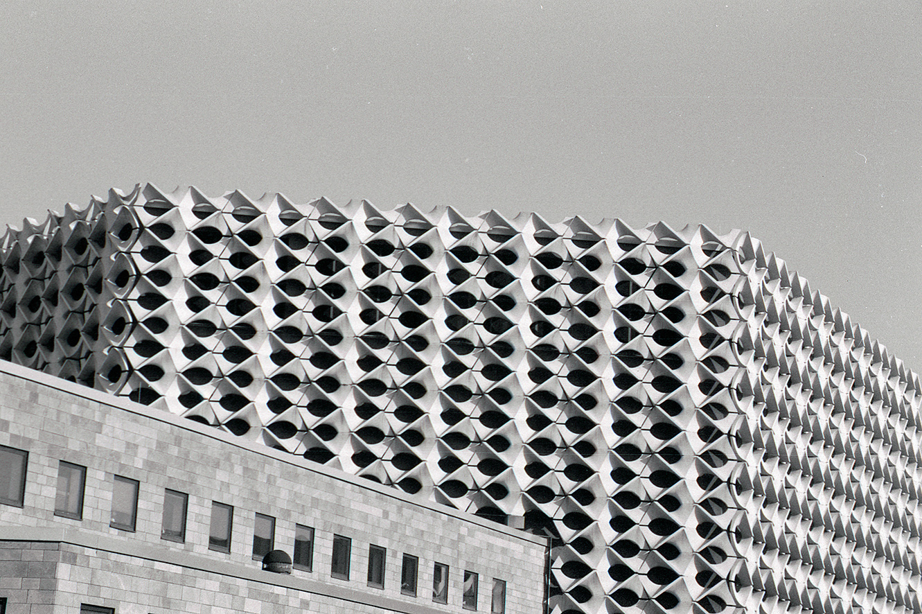 full-frame view of the facade of the civic center chemnitz in black and white.